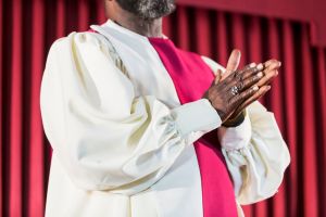 Cropped view of black man in church choir robe