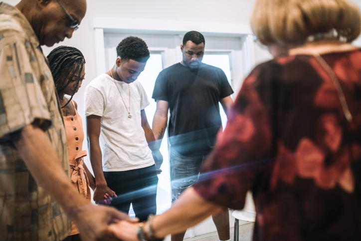 Extended Family Reuniting Together For Prayer