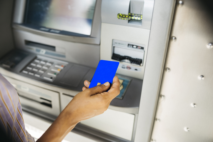 Woman using ATM