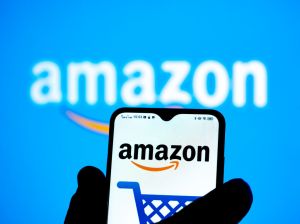 In this photo illustration an Amazon logo seen displayed on...
