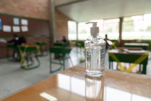 Hand sanitizer on a desk at a school classroom