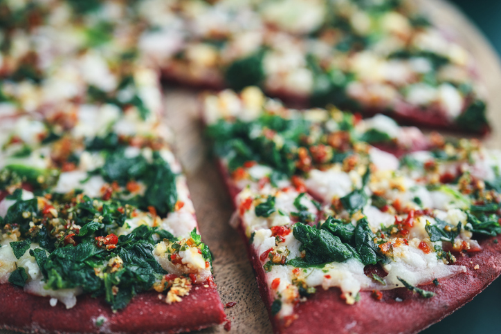 Vegan Pizza with Beet Base, Topped with Spinach and Vegan Cheese