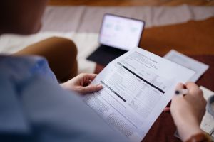From Above Photo Of An Anonymous Business Woman Paying Bills At Home