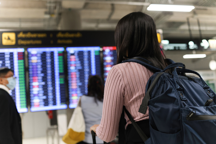 Tourist Women with backpack stand in line check in at Air port, Travel and Vacation