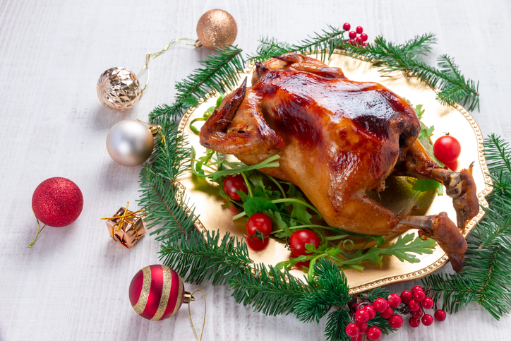 Roasted whole chicken with Christmas decoration.