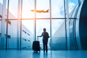 travel concept, woman in airport, passenger silhouette waiting with luggage