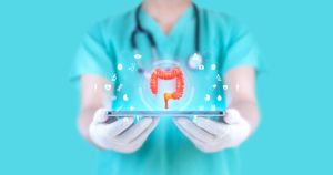 Gastroenterologist examines large intestine with cancerous tissue. Hologram of large intestine. Concept of colorectal cancer study. Doctor on emerald green background