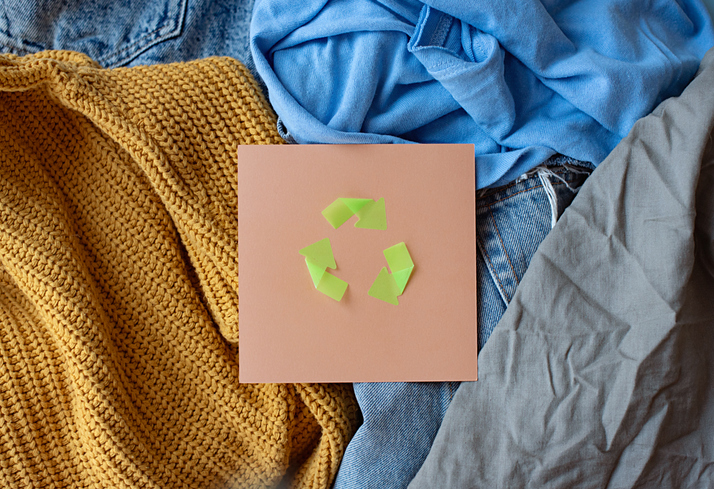 Sustainable life. Recycling symbol. Second hand apparel idea. Circular fashion, donation, charity concept.