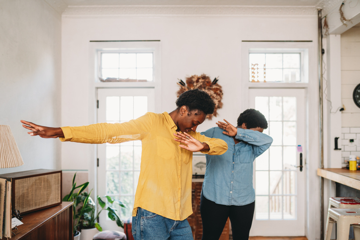 Two friends are doing dabbing movement at home
