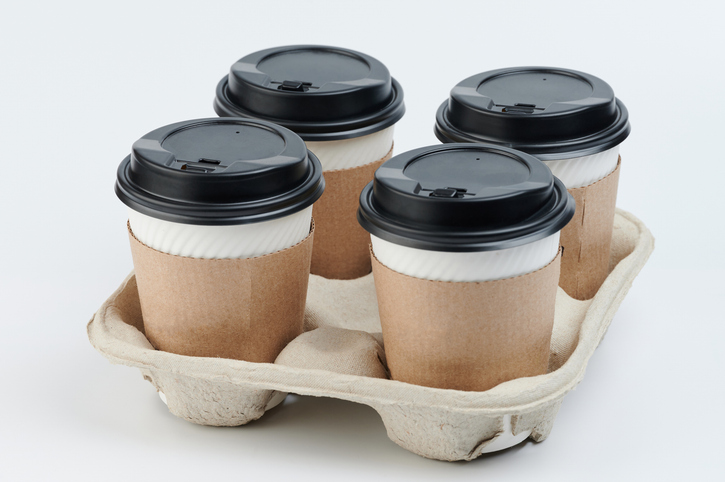 Set of paper cups in tray